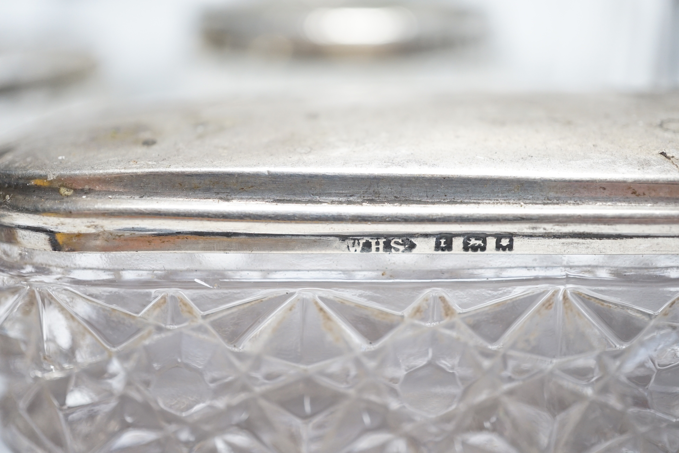 Eight assorted silver topped toilet jars, etc. a silver mounted nail buffer and pen wipe.